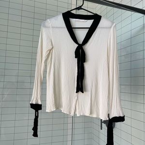 Zara crinkle button blouse with black tie details.